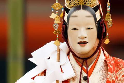 An actor in mask and costume at Takigi Nō at Heian Shrine.