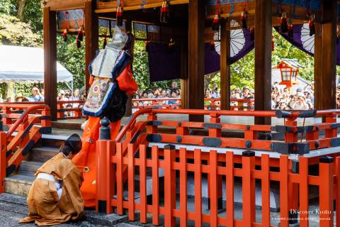 Bugaku dancer walking onto the haiden stage during the Funeoka Taisai at Kenkun shrine.