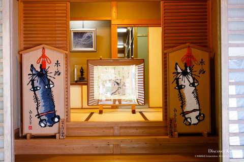 Two votive tablets featuring horses during the Mizu Matsuri at Kifune shrine.