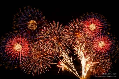 Fireworks above the Hozugawa River at the Kameoka Heiwasai Hozugawa Fireworks Festival.