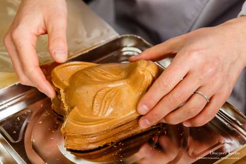 Souvenir rice crackers in the shape of fox faces at Fushimi.