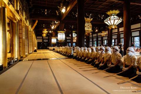 Cleaners line up during the Osusuharai at Nishi Hongan-ji.