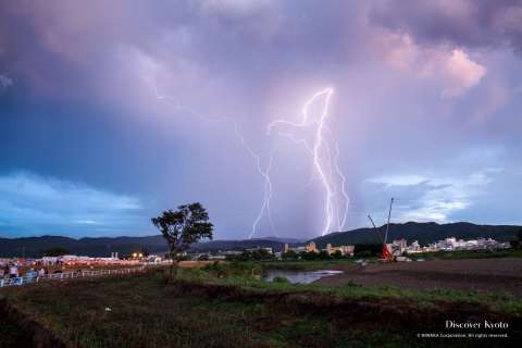 A storm rolls in before the start of the 2015 Kameoka Heiwasai Hozugawa Fireworks Festival.