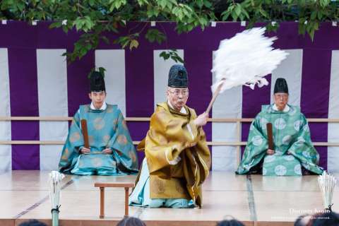 The priests of the shrine perform a ritual during the Kamigyō Takigi Nō at Shiramine Jingu.