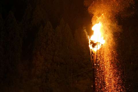 The burning torch at the Hanase Matsu-age.