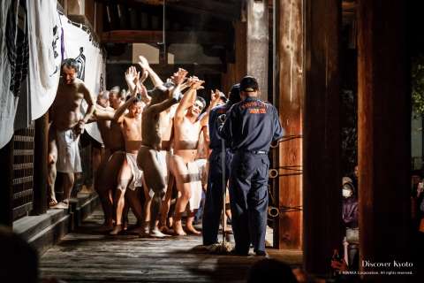 Fire brigade looks on during the Hadaka Odori at Hōkai-ji.