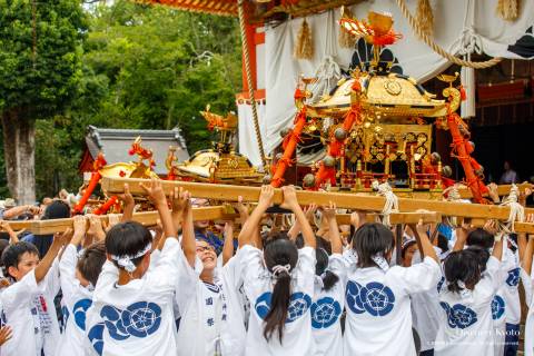 Children carrying a portable shrine during the Hanagasa Junkō at Yasaka shrine.