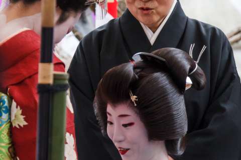 Geiko, maiko and nun during the Baikasai tea ceremony at Kitano Tenmangu shrine.